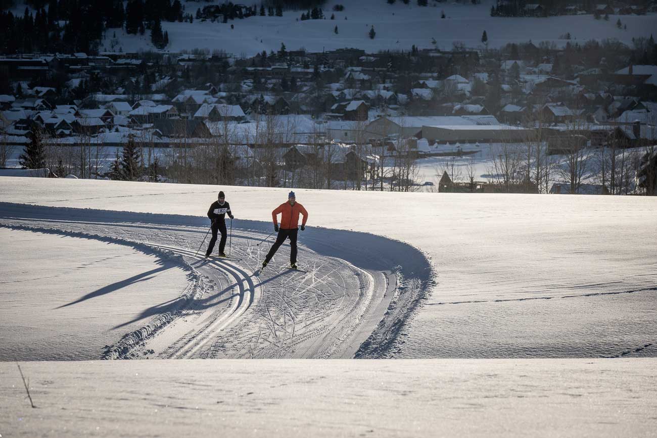 Two nordic skiers on the groomed trails at Crested Butte