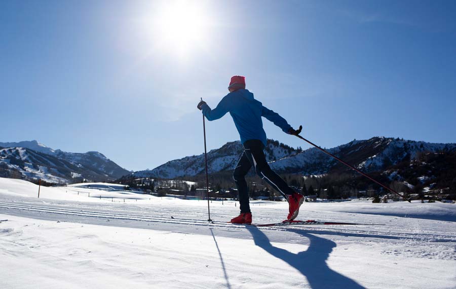 Single skier on trails in the sunshine